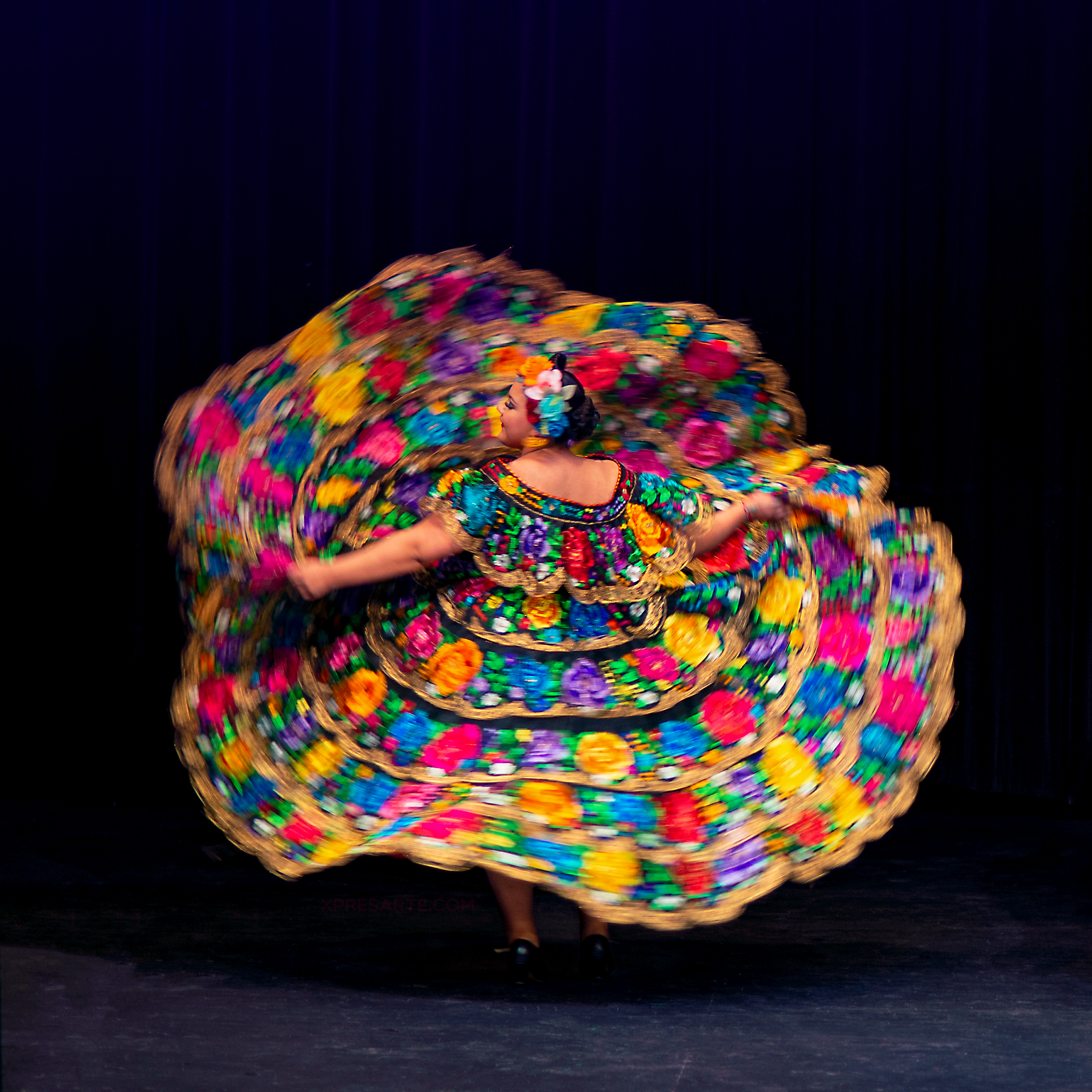 Mexican Dance Company dancer twirling in a dance from Chiapas